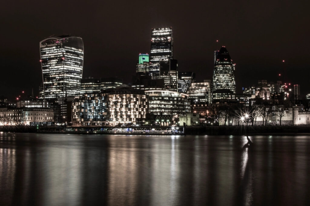 City of London skyline at night, home to many firms behind AI adoption UK businesses report
