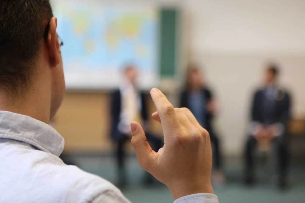 Manager presenting to colleagues in a business meeting
