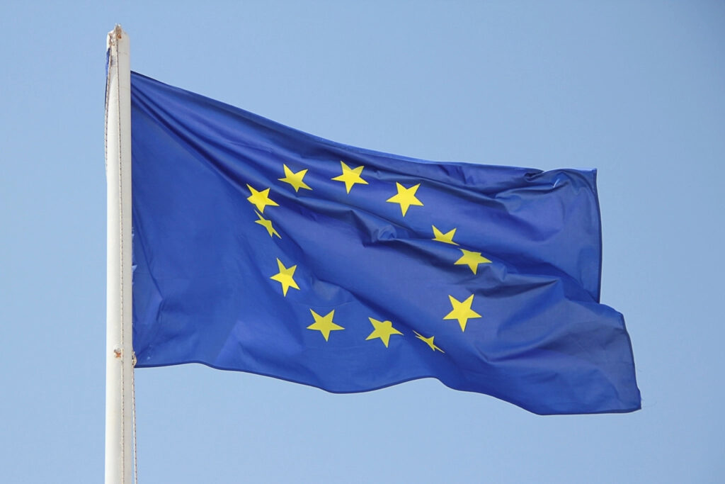 European Union flag flying against a blue sky